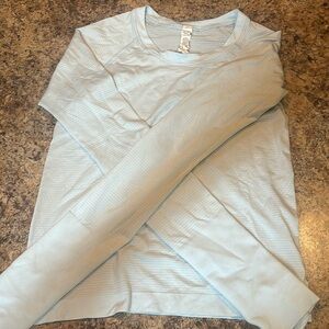 LULULEMON powder blue, cropped swiftly long sleeve shirt, size 4